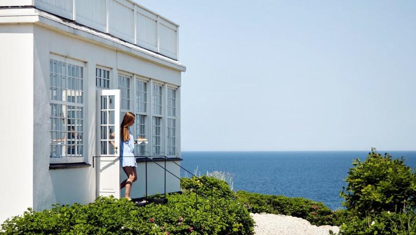 A woman walks out of Helenekilde Badehotel in North Zealand, Denmark