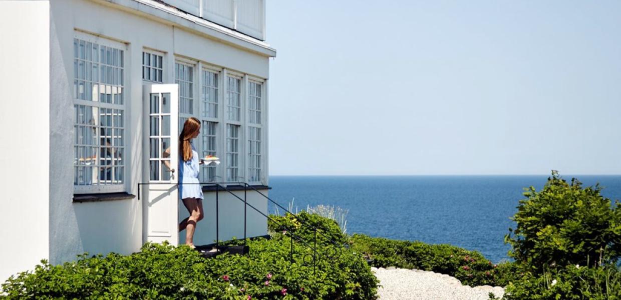 A woman walks out of Helenekilde Badehotel in North Zealand, Denmark