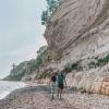 Couple hiking at the beach at Stevns Klint in South Zealand