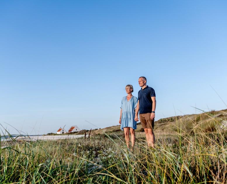 Couple standing in the dunes in Himmerland